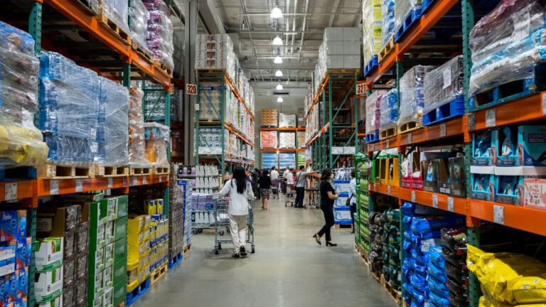 People shopping at a bulk grocery store.