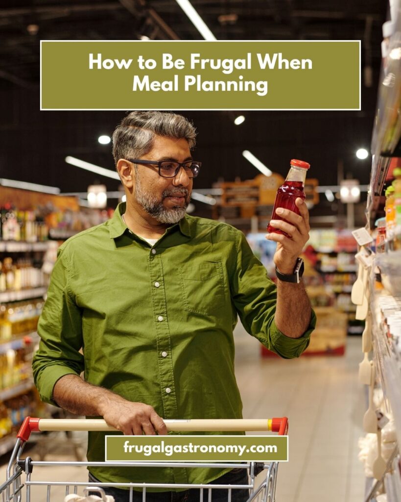 A man looking at a bottled product in a grocery store.