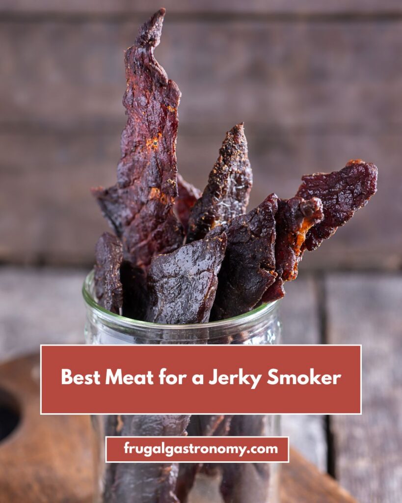 Beef jerky in a mason jar that's placed on a wooden board.