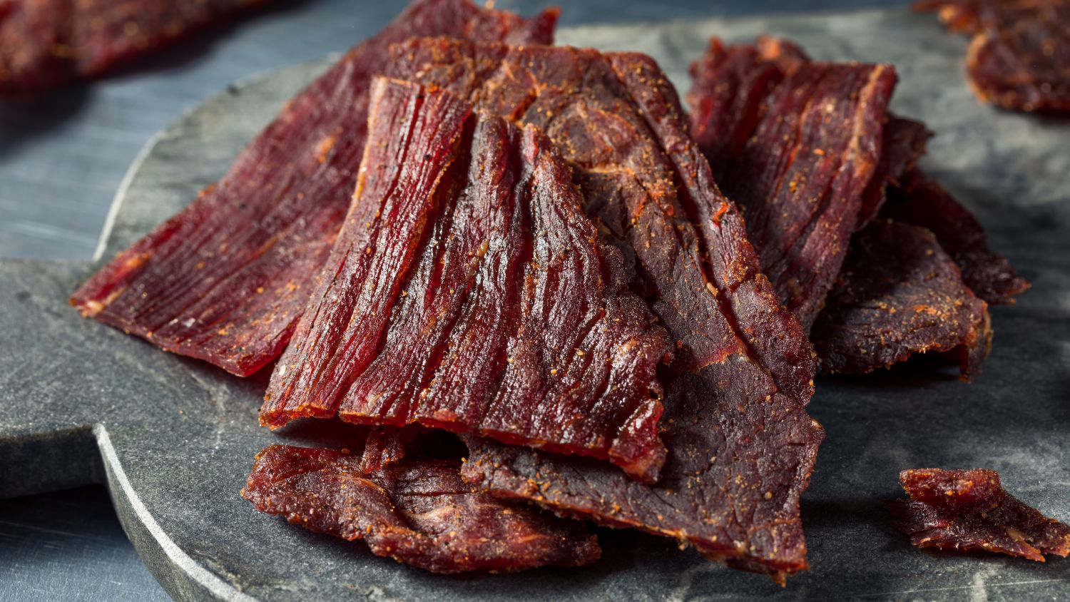 Closeup shot of a plate of jerky.