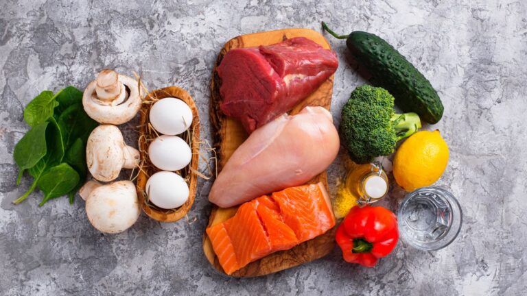 Flat lay shot of fresh ingredients on a gray surface.