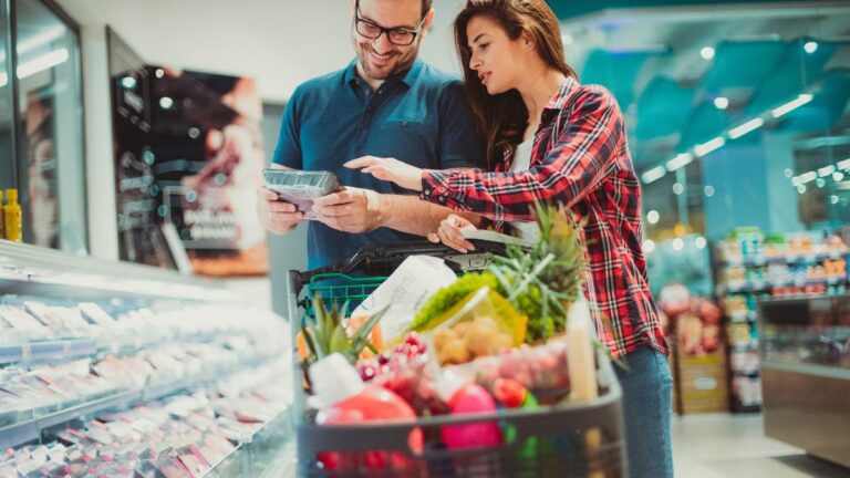 A couple doing grocery shopping.