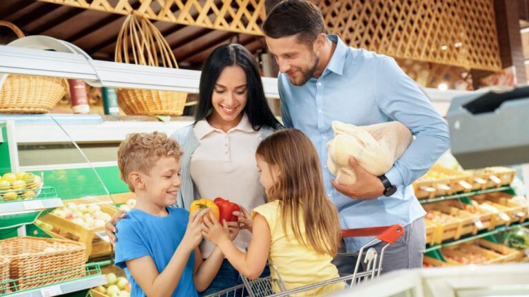 A family of 4 in a grocery store.