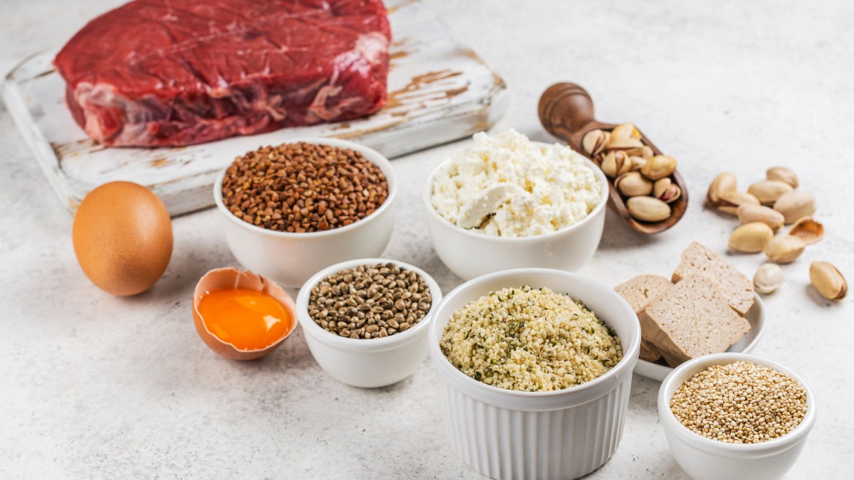 legumes and pulses that are rich protein sources on a marble surface.