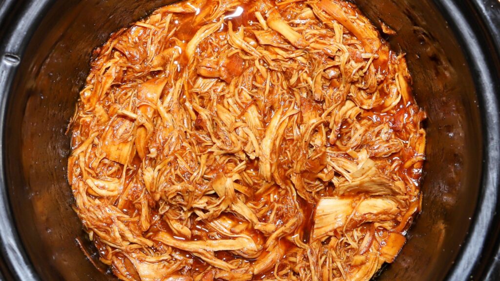 Flat lay shot of a pot of braised shredded meat.