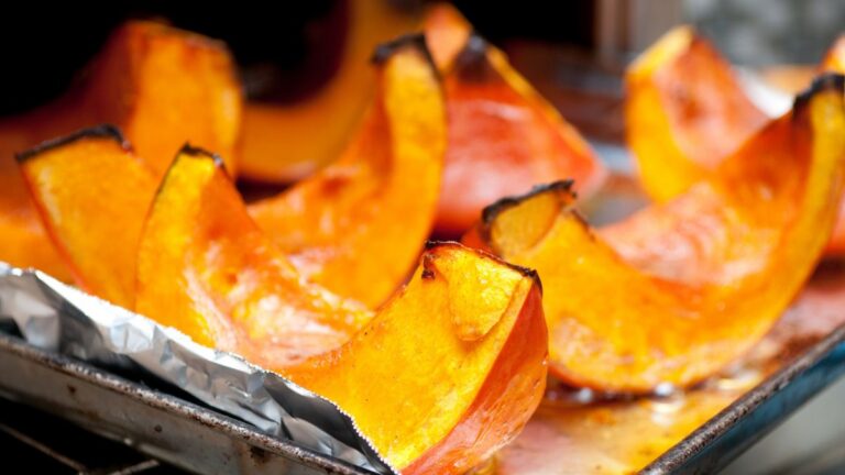 Closeup shot of slices of roasted pumpkins just taken out of the oven. Roasting is one of the many ways on how to use every part of a pumpkin.