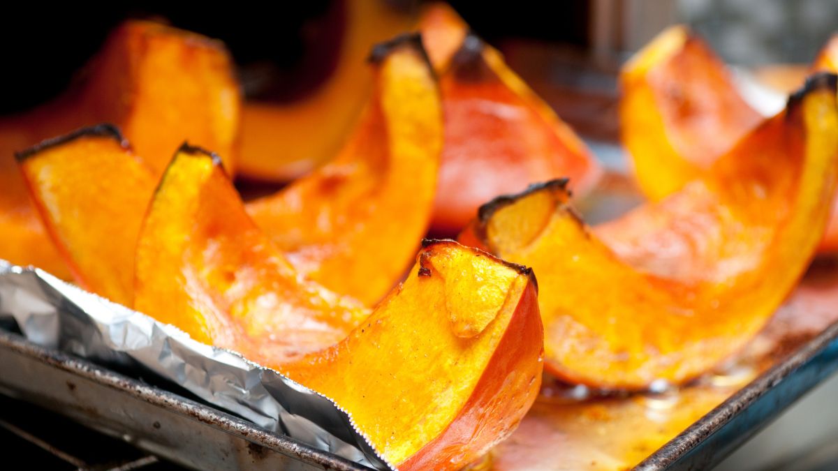 Closeup shot of slices of roasted pumpkins just taken out of the oven. Roasting is one of the many ways on how to use every part of a pumpkin.