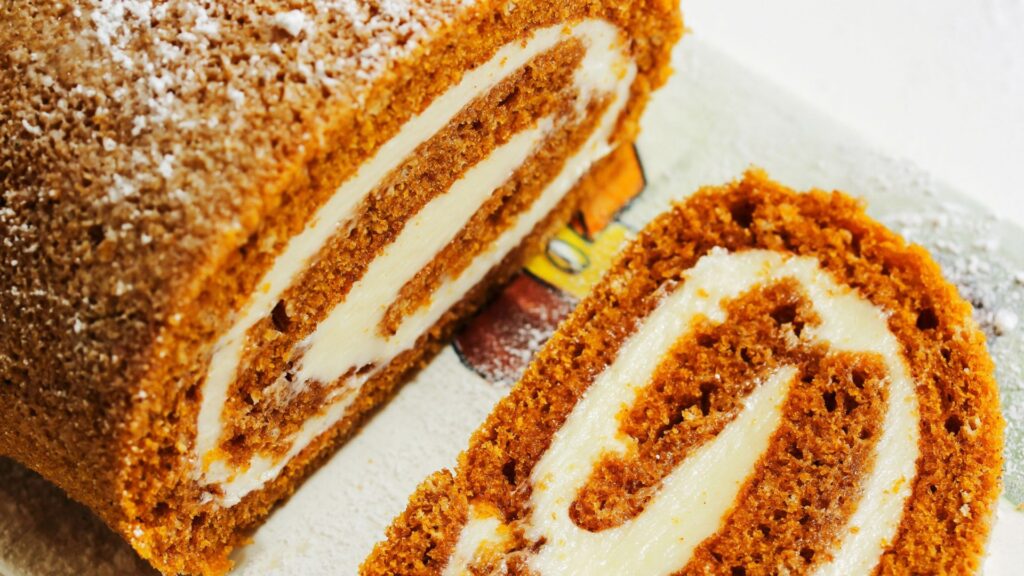 Closeup shot of a finished pumpkin cake roll.