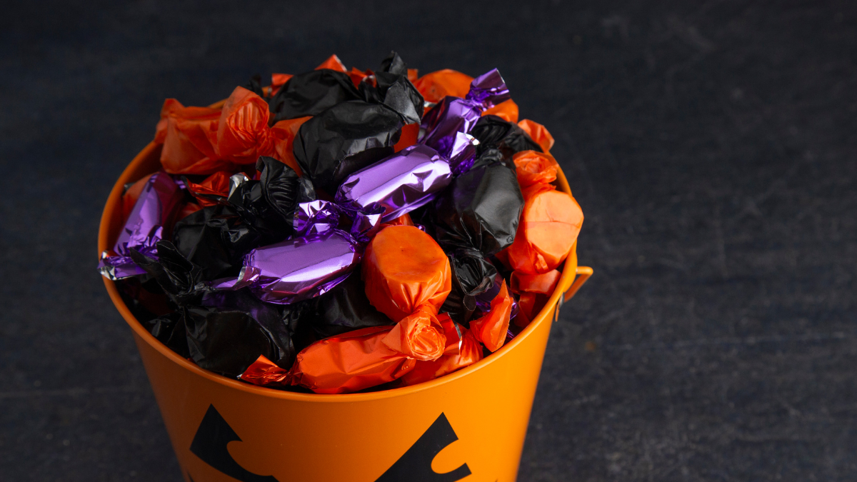 High angle shot of a bucket of Halloween candy.