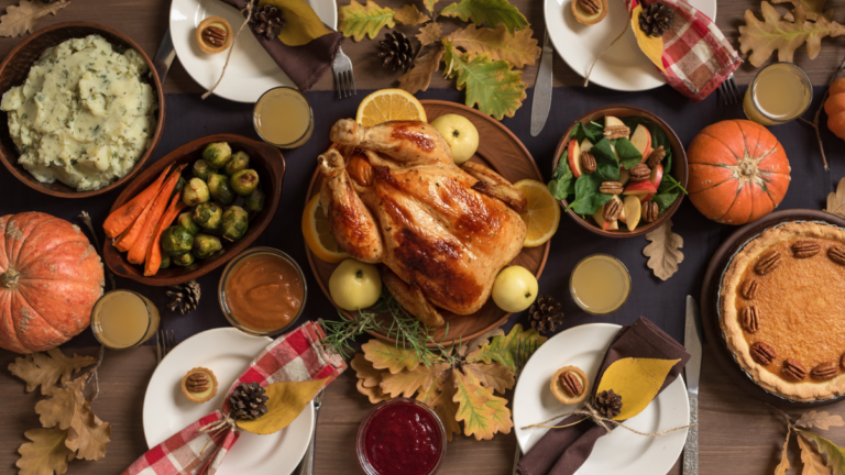 Flat lay shot of a Thanksgiving dinner spread. This article is about what to do with Thanksgiving Leftovers.
