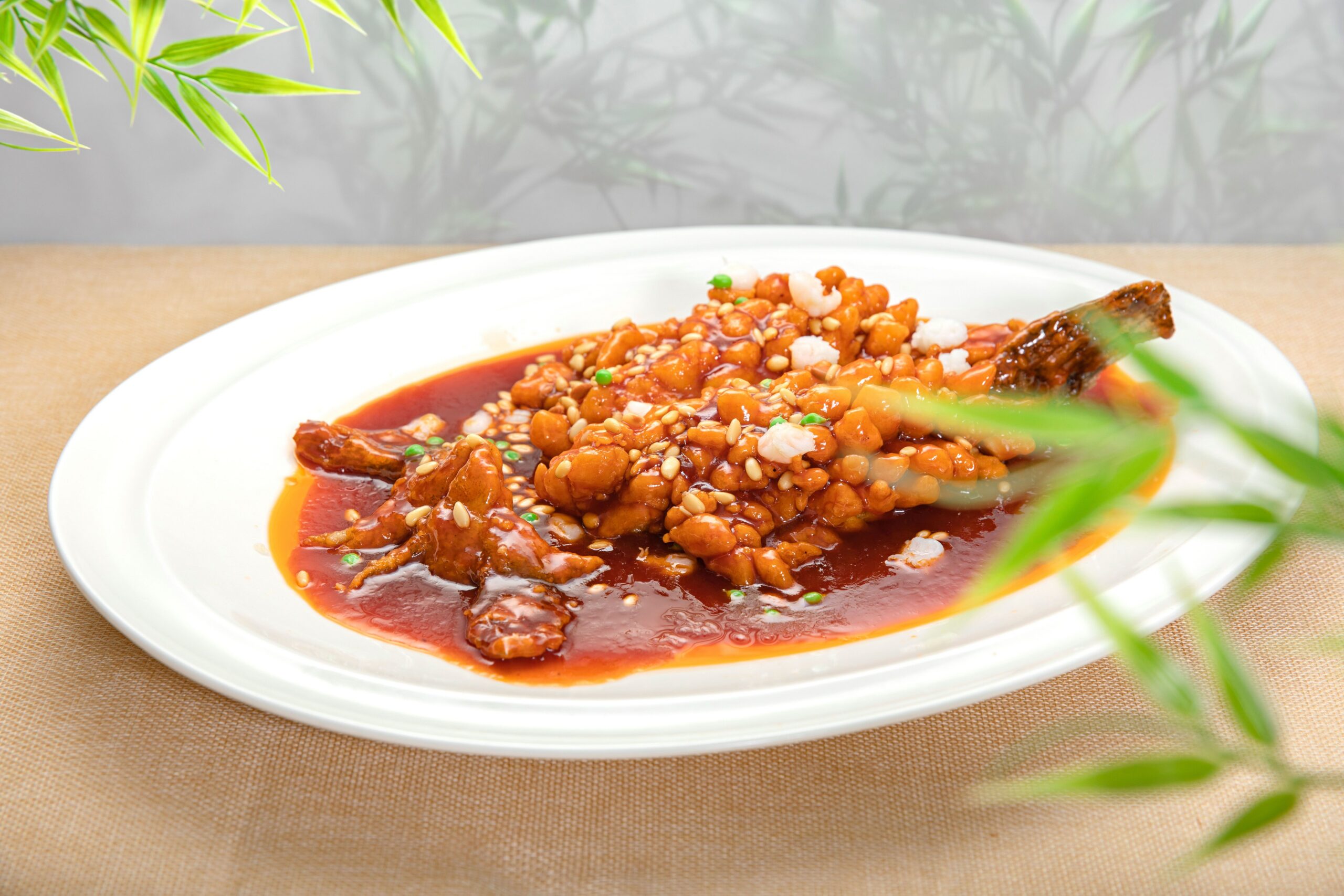 Mouthwatering Kung Pao Chicken garnished with sesame seeds and sauce, offering a flavorful dining experience.