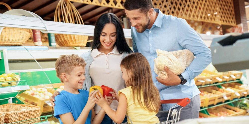 A family of 4 in a grocery store.