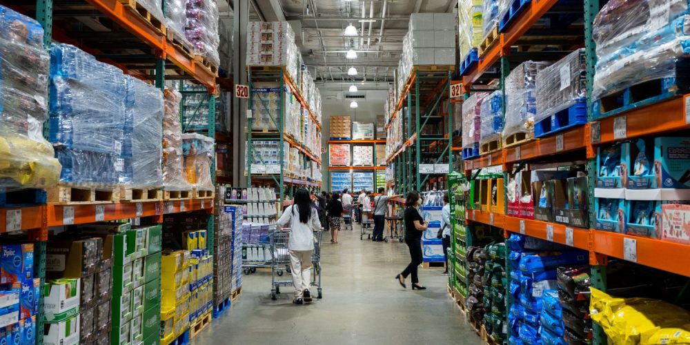 People shopping at a bulk grocery store.