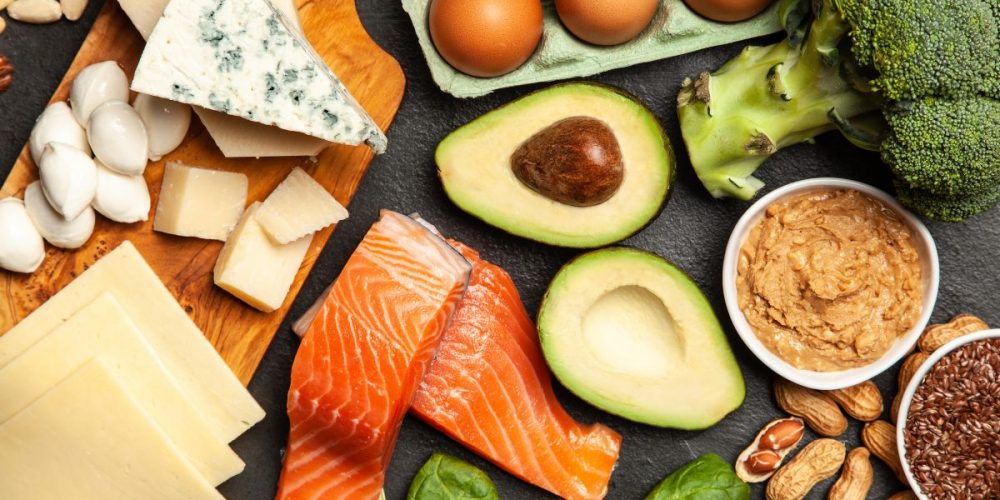 Flat lay shot of fresh produce and slabs of salmon fillet.