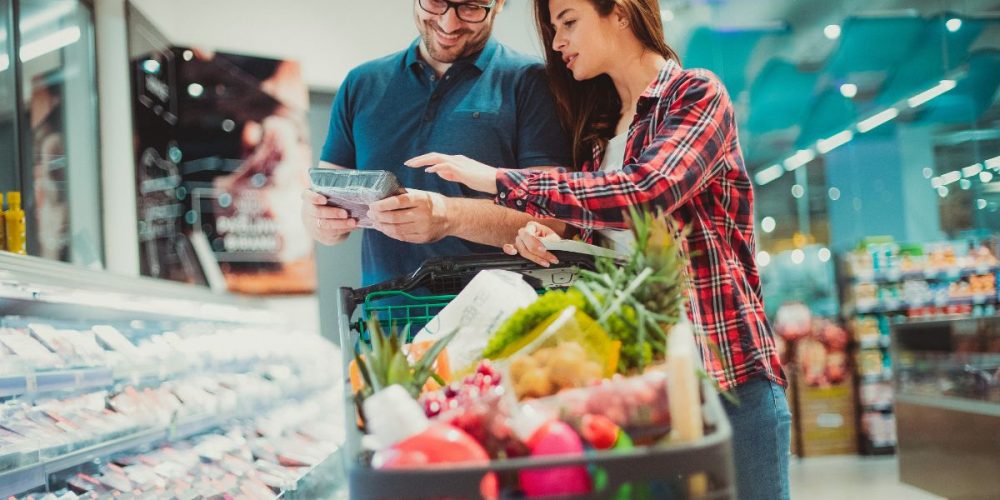 A couple doing grocery shopping.