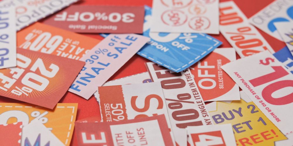 A bunch of coupons on a white surface.
