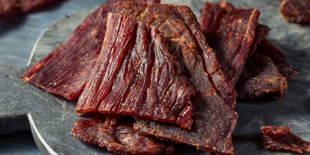 Closeup shot of a plate of jerky.