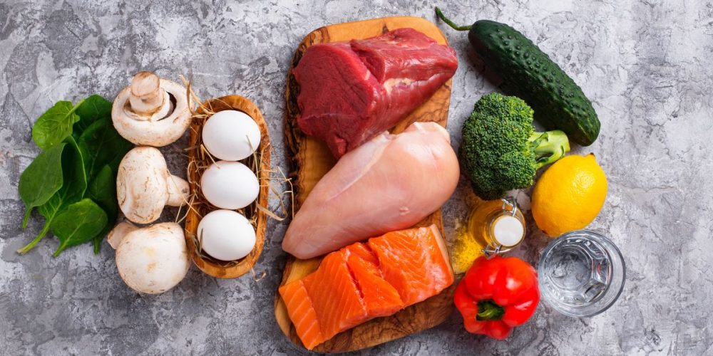 Flat lay shot of fresh ingredients on a gray surface.