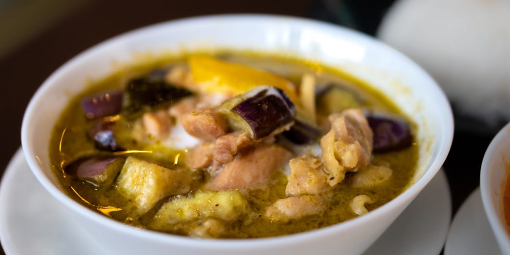 Savor the flavors of Asian curry with chicken and eggplant in a Tokyo restaurant bowl.
